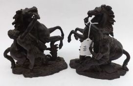 A pair of 19th Century Bronze Marley Horses and Attendants of typical form, on naturalistic