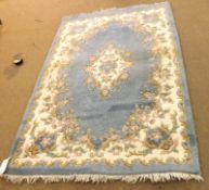 An Indian Wool Ganges Carpet, floral patterns on a pale blue field, 1.8m x 1.2m