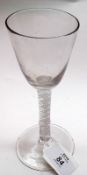 An 18th Century Wine Glass with tapering conical bowl and double air twist stem, terminating in a