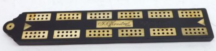 A 19th Century Ebony and Bone Inlaid Cribbage Board, with central panel marked “J Christie 1807”,