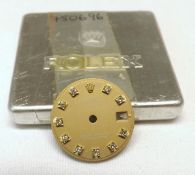 A Diamond Mounted Ladies Rolex Wristwatch Dial (only), inscribed to the gilded dial, “Rolex,