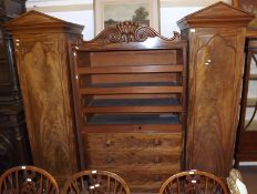An Early Victorian Mahogany Turret Wardrobe, the two side sections with apex pediments to a full
