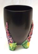 A Clarice Cliff Vase of tapering circular form, “My Garden”, the plain black body with floral relief