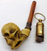 A 20th Century Composition Tobacco Pipe, the bowl formed as a skull; together with a reproduction