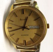 A last quarter of the 20th Century Gold Plated Quartz Centre Seconds Calendar Wristwatch,