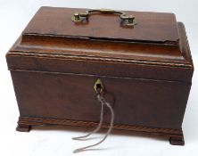 A late 18th Century Mahogany Tea Caddy, the ogee top with central brass carry handle and void