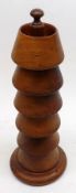 An unusual Treen Stand containing six small Wooden Stands or Candle Holders, 11” high