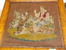 A 19th Century Coloured Tapestry Picture of a boy and young dog, in maple frame, (distressed and A/