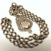 A white metal Curb Link Watch Chain with hallmarked Silver Medallion Mount