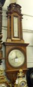 A late 19th Century Monumental Oak Cased Barometer, Negretti & Zambra, “Instrument Makers to Her