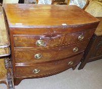 A Victorian Mahogany Bow Front Chest of two short and two long drawers with brass plate handles,