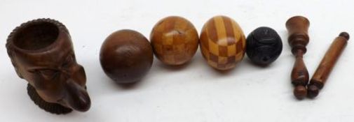 A Mixed Lot: three assorted Treen Balls, a Treen Egg, a Miniature Rolling Pin and an unusual