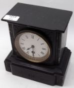 A late Victorian Black Marble Small Mantel Clock, with veined pilasters, circular face with Roman