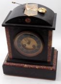 A late 19th/early 20th Century Black Marble Mantel Clock with domed top over a circular face with