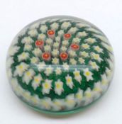 A 20th Century Paperweight with radiating foliate design on a predominantly green ground, 3 ¾”