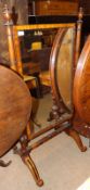 A Victorian Mahogany Framed small Cheval Mirror, central rectangular glass supported on two turned