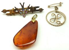 A Mixed Lot: packet containing Amber Pendant; an H Design openwork gilt metal Brooch/Pendant and