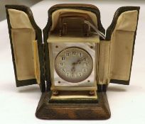 A 1st quarter of the 20th Century Miniature Travelling Clock, mother-of-pearl cased, the guilloche