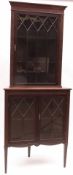A late 19th/early 20th Century Mahogany Corner Cabinet, possibly by Shoolbred & Sons, the top