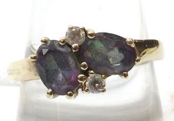 A hallmarked 9ct Gold two oval Amethyst and two small brilliant cut Diamond Ring