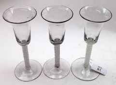 A collection of three 18th Century Bell Bowled Wine Glasses with double opaque twist stems and