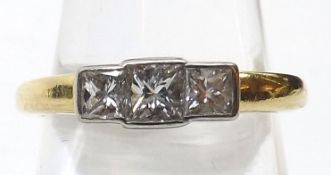 A hallmarked 18ct Gold Princess cut three Diamond Ring, line set, approximately .4ct total