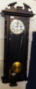 A Vienna style Ebonised Cased Wall Clock, with broken moulded pediment over glazed front and