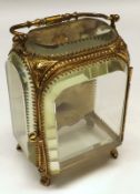 A last Victorian gilt metal and bevelled glazed Watch Display Case, formed as a cabinet with