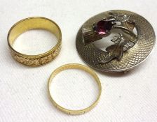 A late Victorian 18ct Gold Wedding Band, with foliate engraved decoration; a further unmarked yellow