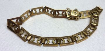 A yellow metal fancy rectangular and chevron link Bracelet, 18 cm long and weighing approx 6.5 gm