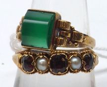 An Oriental mid-grade Yellow Metal Ring set with a single curved green stone, stamped “585”;