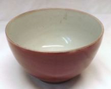 A 20th Century small Chinese Sang de Beouf Bowl of plain tapering circular form, 4 ¾” diam