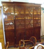 A 19th Century Mahogany Breakfront Bookcase, the moulded cornice to four astragal glazed doors,