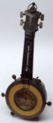 An unusual Novelty Mantel Clock/Barometer modelled as a Banjo, the neck with two scale thermometer