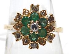 A hallmarked Gold six small Emerald and twelve small brilliant cut Diamond Ring (marks incomplete)