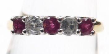 A hallmarked 18ct Gold two small brilliant cut Diamond and three small Ruby line set Ring, the two