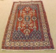 A Caucasian Wool Carpet, triple gull border, central panel of lozenges and tree of life designs,