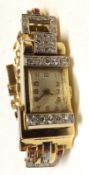 A Ladies Vintage yellow metal cased Cocktail Watch, set with small Brilliant Cut Diamonds and