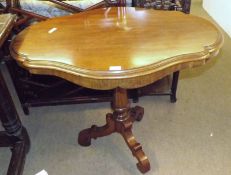 A late 19th Century Mahogany Pedestal Table, the shaped oval top to a turned column raised on a