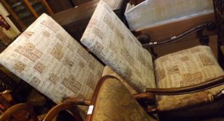 A pair of large 18th Century Armchairs, recently reupholstered, the arms carved with acanthus leaf