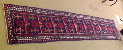 A 20th Century Caucasian style Runner with triple gull border, central panel of keyhole/geometric