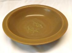 A Song or Yuan Brown “Two Fishes” Bowl, of circular form, 8” diameter