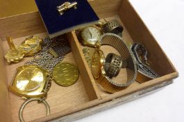 A metal tin containing three Gents Wristwatches and other oddments