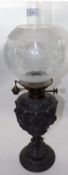 A late 19th/early 20th Century Pewter Based Oil Lamp with lift-out font, opaque glass shade and