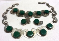 An interesting 20th Century Mexican white metal and green stone mounted Jewellery Set of wave design
