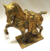A 20th Century Gilded Bronze Model of a Tang type horse, standing on an integral base with one front