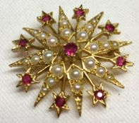 A hallmarked 9ct Gold Starburst design Brooch/Pendant, the points set with Seed Pearls