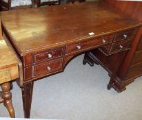 An early 20th Century Mahogany Desk, plain top with moulded edge over central frieze drawer with