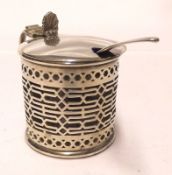 An Edwardian Drum Mustard with slot pieced sides, flat hinged lid with shell thumb-piece, plain