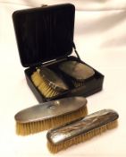 A cased pair of Gents engine-turned Silver Backed Hairbrushes, together with the matching Comb,